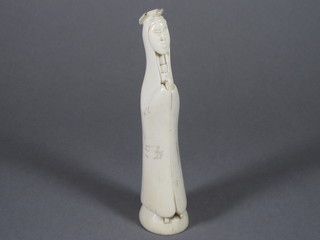 An Oriental carved ivory figure of standing Nun 7"