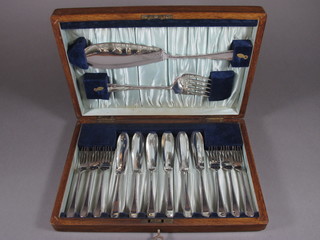 A set of 6 silver plated fish knives and forks complete with  servers, cased