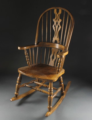 An elm Windsor rocking chair with H framed stretcher