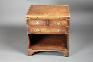 A figured walnut military style cabinet fitted a brushing slide above 2 short and 1 long drawer with recess, raised on bracket  feet 21 1/2"w x 16"d x 24"h