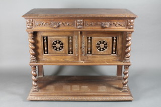 A 19th Century Continental carved oak buffet with hinged lid incorporating a shelf and fitted a marble panel above 2 long  drawers, the base fitted a cupboard enclosed by panelled doors  above a recess, raised on turned supports 43"w x 17 1/2"d x  39"h