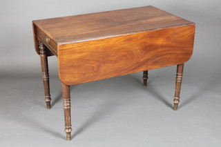 A Victorian mahogany Pembroke table fitted a drawer raised on  turned supports 39"w x 22"d