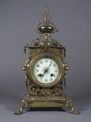 A French 8 day striking mantel clock with porcelain dial  and Arabic numerals contained in a gilt mounted case