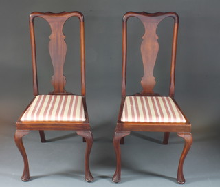 A pair of Queen Anne style slat back dining chairs with  upholstered drop in seats on cabriole supports