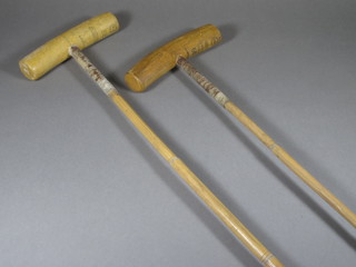 A number 50 polo mallet by J Slater & Sons and a number 52