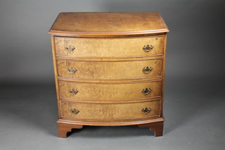 A Queen Anne style figured walnut bow front chest of 4 long  drawers with brass swan neck drop handles, raised on bracket  feet 29"w x 31" 1/2"h x 20"d