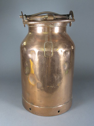 A circular copper milk churn