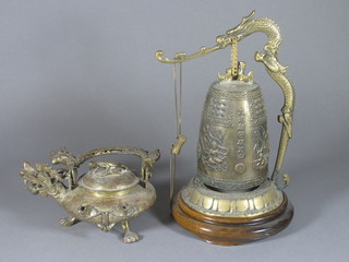 An Oriental heavy cast gilt metal kettle 6" and a do. bell 11"