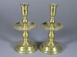 A pair of brass candlesticks 8"