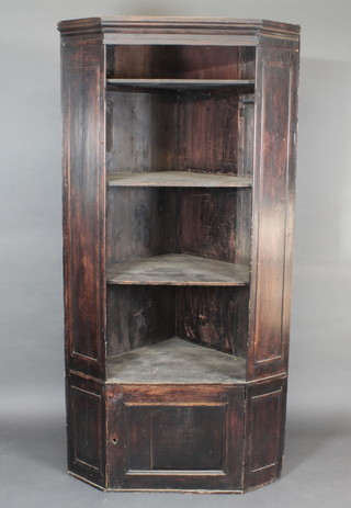 An 18th Century pine open corner cabinet, the interior fitted shelves, 38"w x 76 1/2"h x 26 1/2"d