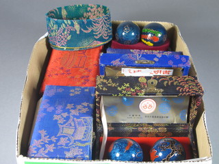 10 various Oriental enamelled iron healing balls together with a rectangular Oriental plaque