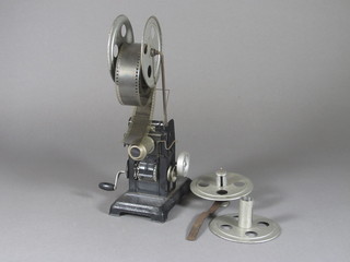 An early cine projector and 3 films