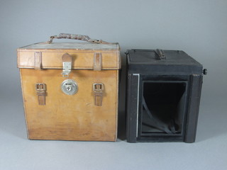 An early camera by Videx, no lenses, complete with leather carrying case