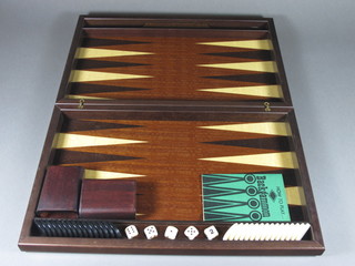 A wooden backgammon set, cased