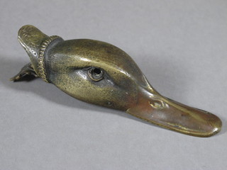 A gilt metal paper clip in the form of a ducks head 5", 1 eye  missing,