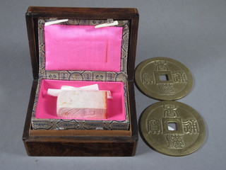 An Oriental carved marble seal 2" and 2 circular Oriental bronze coins and a walnut box