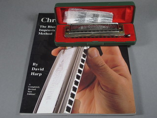 A harmonica Chromonica 270 boxed and 1 volume David Harp  "How to Play Your Chromonica Harmonica"