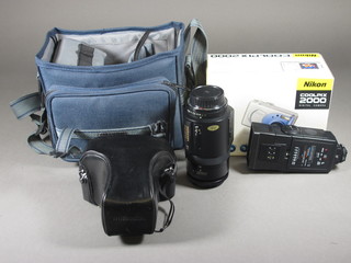 A Miranda MS.3 camera and a Miranda 28-75mm lens  1:3.5-4.8mc, a Rollei camera, a Miranda auto focus lens 7.5-200mm, a 1:4.5mc lens, a Miranda flash unit and a Nikon  Coolpix 2000 digital camera