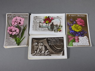 A collection of various postcards and birthday cards
