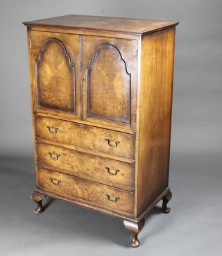 A Queen Anne style walnut tall boy with crossbanded top, the upper section fitted a cupboard enclosed by a panelled door, the  base fitted 3 long drawers raised on bracket feet 30"w x 19 1/2"d  x 49"h