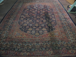 A fine quality blue and red ground Persian carpet with floral panel to the centre within multi-row borders, signed, 210" x  157", slight wear, patched,  ILLUSTRATED  PLEASE NOTE THAT THIS CARPET HAS BEEN CUT DOWN
