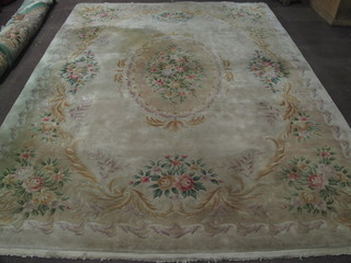 A yellow ground and floral patterned Chinese carpet 145" x 109"