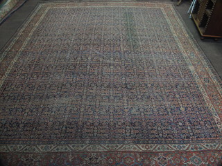 A Persian carpet with all over geometric design 207" x 166", worn and some cuts to edges
