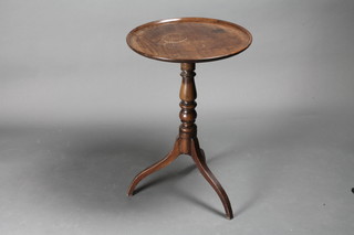 A 19th Century circular mahogany wine table with dish top,  raised on pillar and tripod base 19"