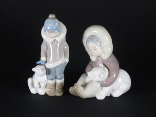 A Lladro figure of a seated boy with Polar Bear and 1 other standing boy with Plar Bear 6"