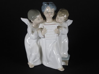 A Lladro figure of a 3 Angel choristers 7"