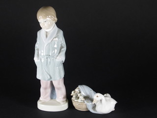 A Lladro figure of a standing boy in dressing gown 8" and a  Lladro figure of geese in a basket 3"