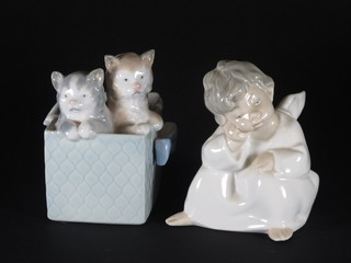 A Lladro figure of a crouching Angel 4" and a Nao figure of a  basket with kittens 3"