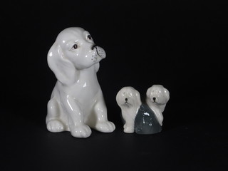 A Beswick figure of a seated white puppy 4" and 2 Beswick  figures of Old English Sheep Dogs 2"
