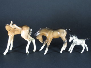 A Beswick figure of a standing Palomino foal 3 1/2", do. Bay  foal 4" and 1 other 5"