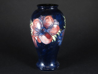 A modern Moorcroft blue vase decorated Anemones, the base  marked WM and impressed Moorcroft 10"   ILLUSTRATED