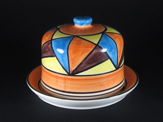 A circular blue glazed cheese dish and cover, the base marked  hand painted Clarice Cliff 4"