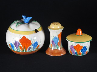 A circular Clarice Cliff Crocus pattern preserve jar and cover 3",  do. mustard pot 1 1/2" and a waisted pepper pot 2" - chip to  base"
