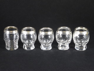 5 shot glasses with silver collars