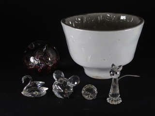A white glazed jelly mould, a Caithness Myriad pattern paperweight and 3 Swarovski figures