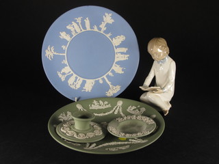 A Nao figure of a seated child reading a book 6", 2 Wedgwood  Jasperware plates 9", do. candlestick and ashtray