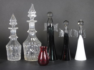 2 panel cut decanters and stoppers, 3 Art Glass figures of Angels 10" and 12" and a red Whitefriars vase 4"