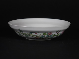 An Oriental circular shallow dish with floral decoration the base with 6 character mark 6", slight chip to rim,