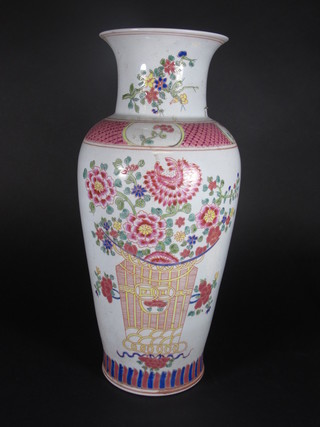 An Oriental pink and floral patterned vase decorated a basket of flowers, base with 6 character mark 16"
