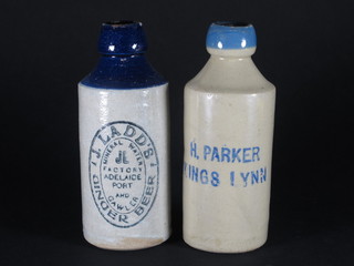 A H Parker of Kings Lynn blue ginger beer bottle and 1 other J  Ladd's, both with blue tops