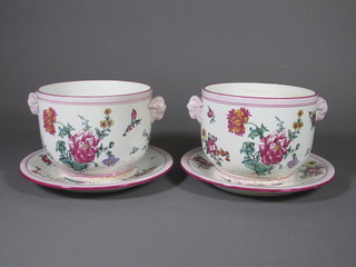 A pair of floral patterned pottery twin handled jardinieres and saucers, bases marked Gien 5"