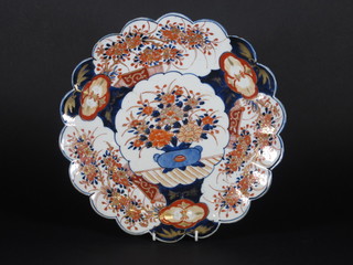 A Japanese Imari porcelain charger with lobed rim and floral decoration, 12", chip to rim,