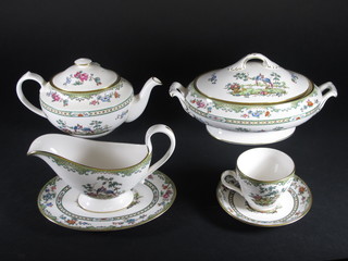 A 47 piece Spode Elysee pattern dinner service comprising 2 oval tureens and covers, sauce boat and stand, 8 dinner plates 11", 8  side plates 8", 8 tea plates 6", tea pot, sugar bowl and milk jug,  8 cups and 8 saucers