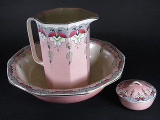 A pink and floral patterned 3 piece wash set comprising octagonal jug, bowl and soap dish
