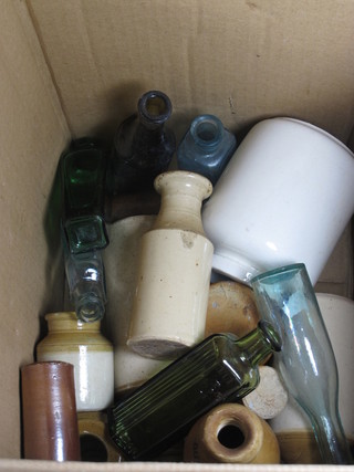 A collection of stoneware and other bottles