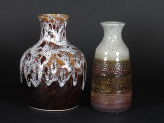 A Purbeck Art Pottery club shaped brown glazed vase 7 1/2" and  a brown glazed Art Pottery vase 8"